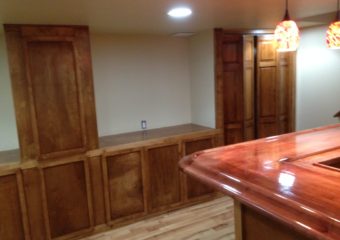 stained wooden cabinets and bar top