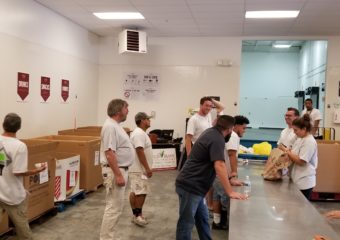 painting company employees volunteering at local food bank