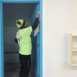Painting and Wallcovering Company Employee Spot Cleaning School Doorway