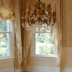 cream wallpapered dining room with drapes