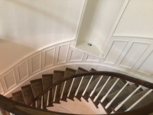 Interior Spiral Staircase surrounded by White Walls